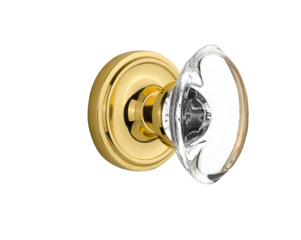 Nostalgic Warehouse Classic Rosette with Oval Clear Crystal Glass Knob, Double Dummy, Unlacquered Brass | Elegant Traditional Door Hardware — Unlacquered Brass