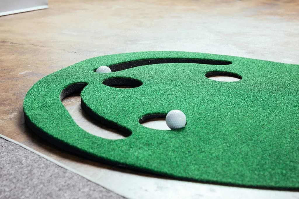 PUTT-A-BOUT Par Three Plus Golf Putting Green 3' x 9' | Kidney-Shaped Practice Mat with 3 Cups & Hazards - view 5