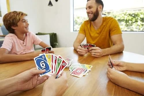 Mattel Games UNO Left Hand Tin Card Game for Family Night with Cards Specially Designed for Left-Handed Players (112 Cards) thumbnail 2