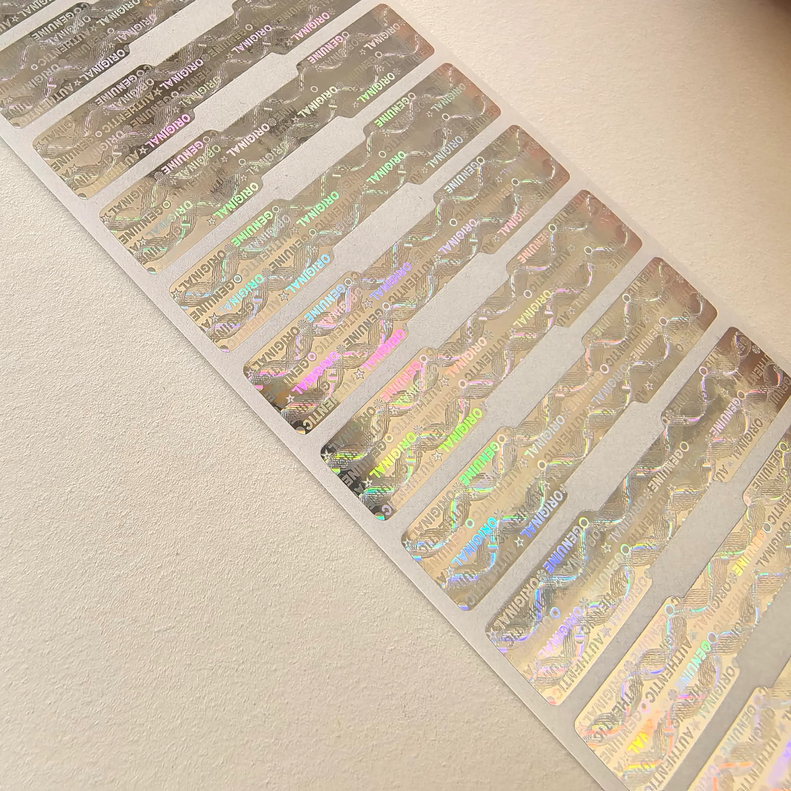 TLK&FBB Silver Hologram Tamper Proof Stickers on Roll | Sequential Serial Numbering - view 2
