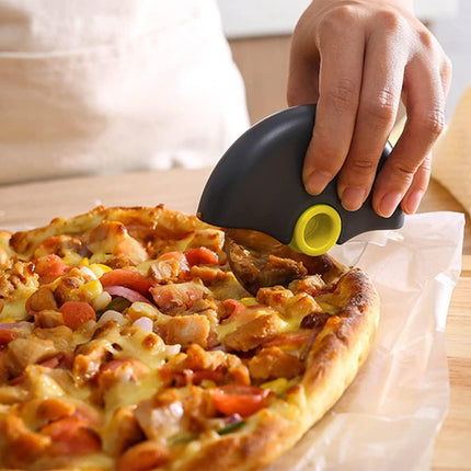 Lady using the cutter to cut the pizza base 